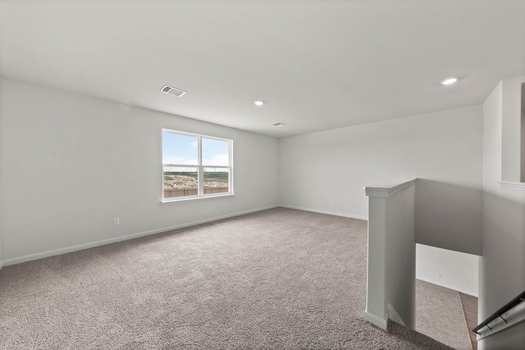 The large loft of the Driftwood is spacious and has a large window to let in great, natural light.