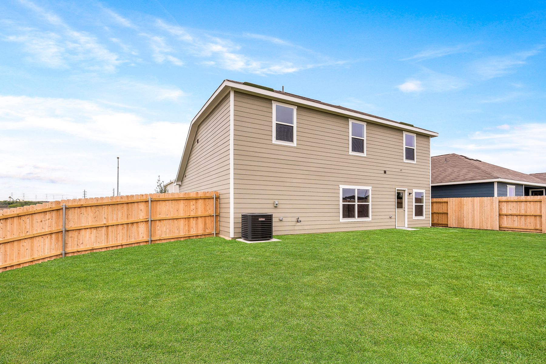 The back yard of the Cypress is fully fenced in.