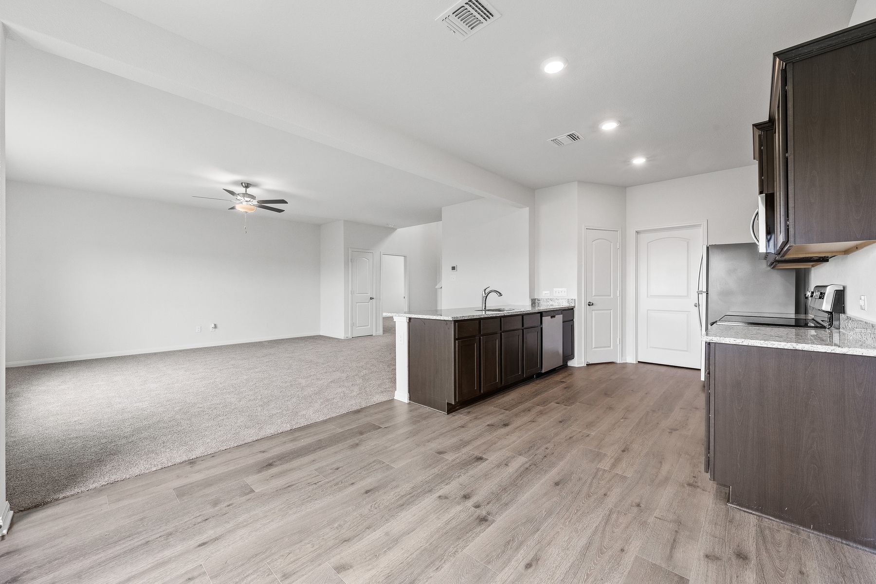 The kitchen of the Cypress has sprawling granite counters.