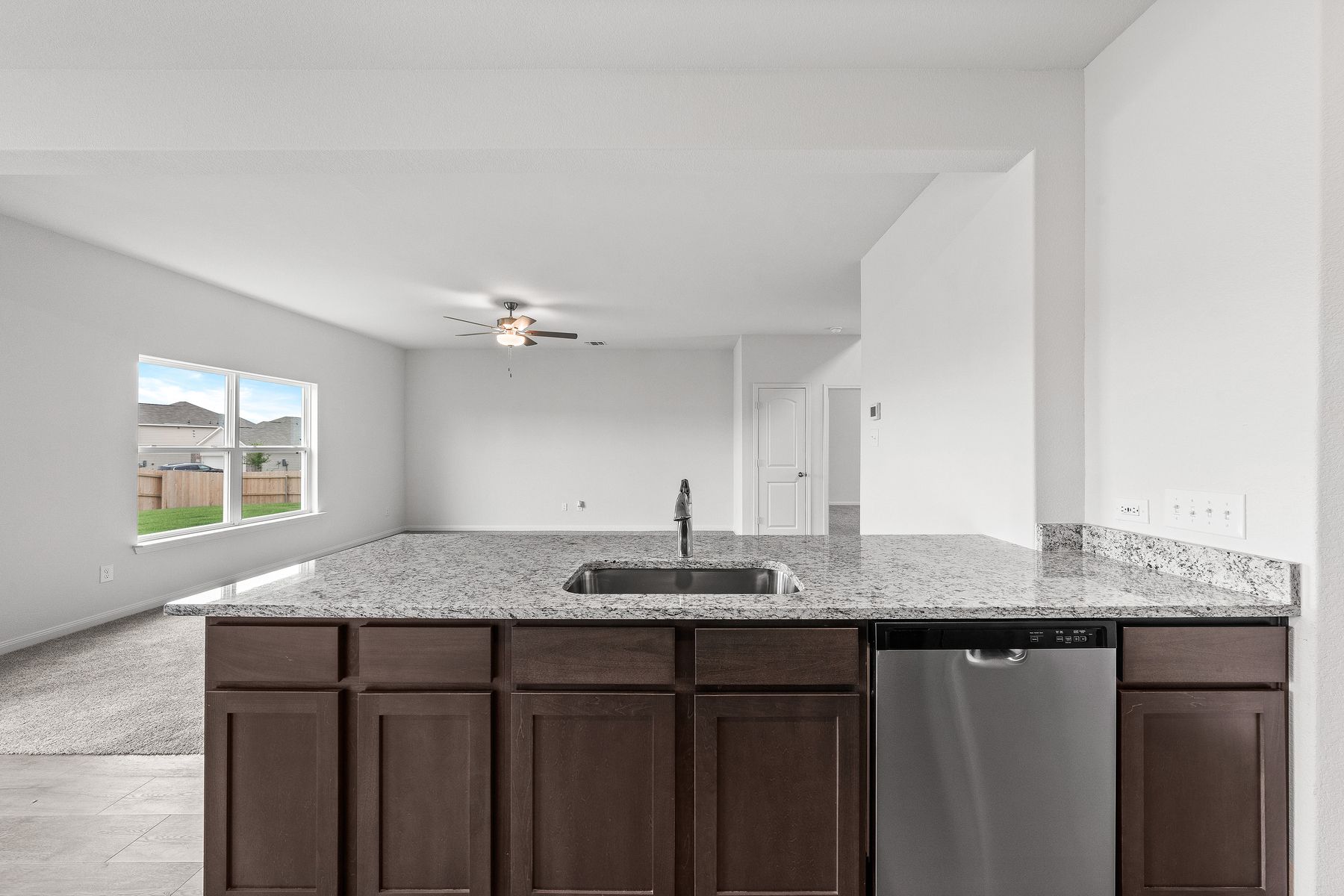 The kitchen of the Cypress sits adjacent to the family room.