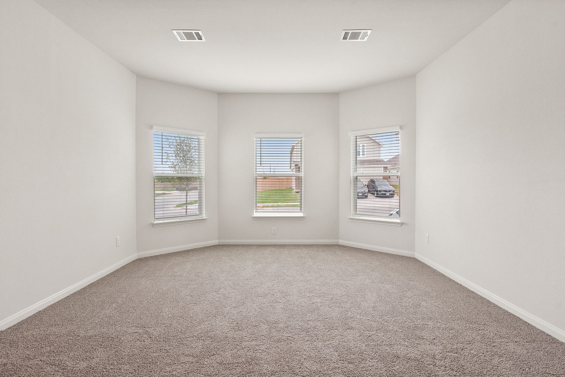 The master bedroom of the Cypress has three large windows that let in great natural light.