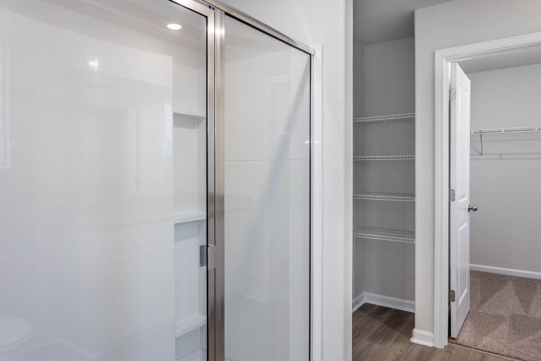This bathroom has a glass-enclosed shower