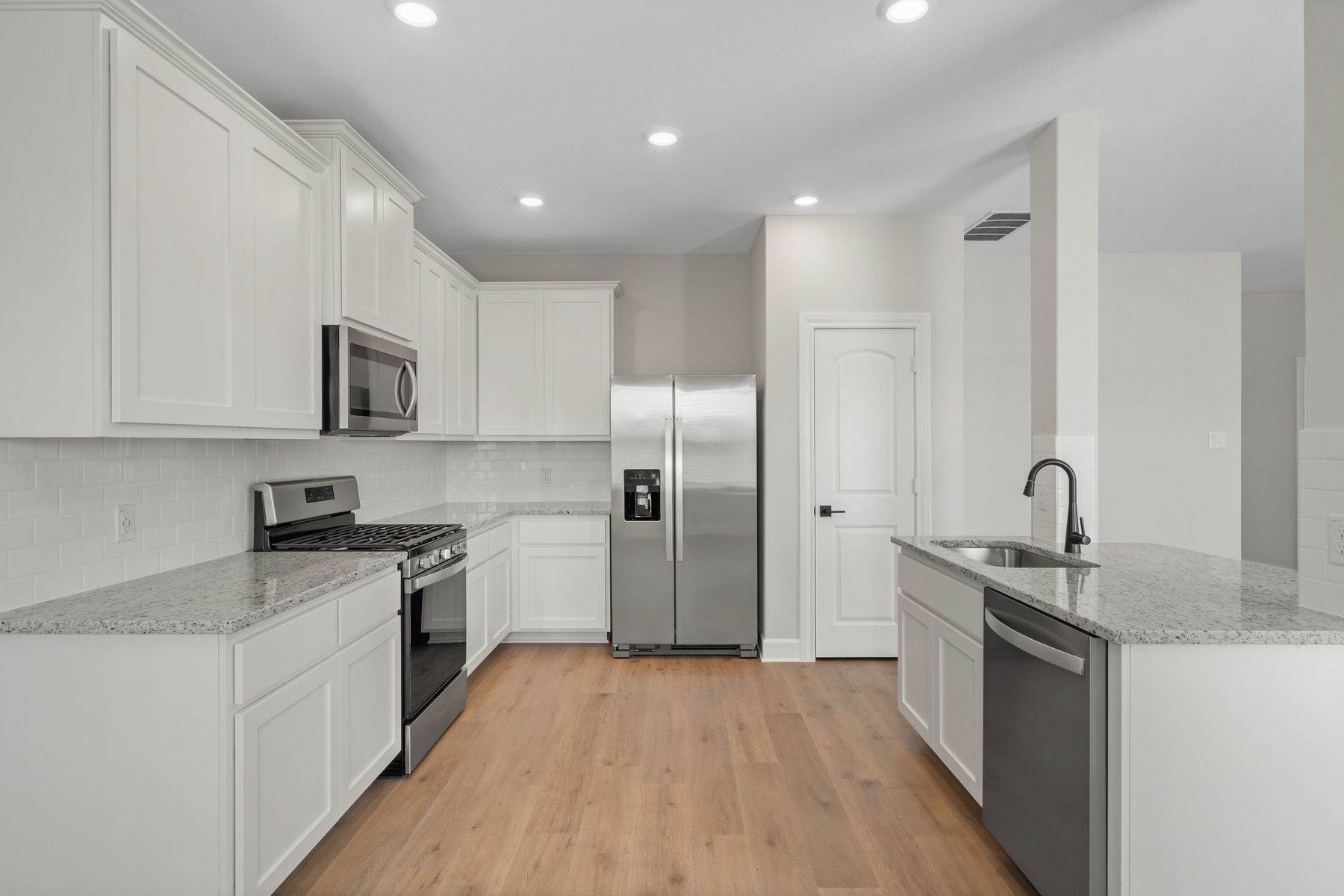 The beautiful kitchen has upgraded, stainless steel appliances.