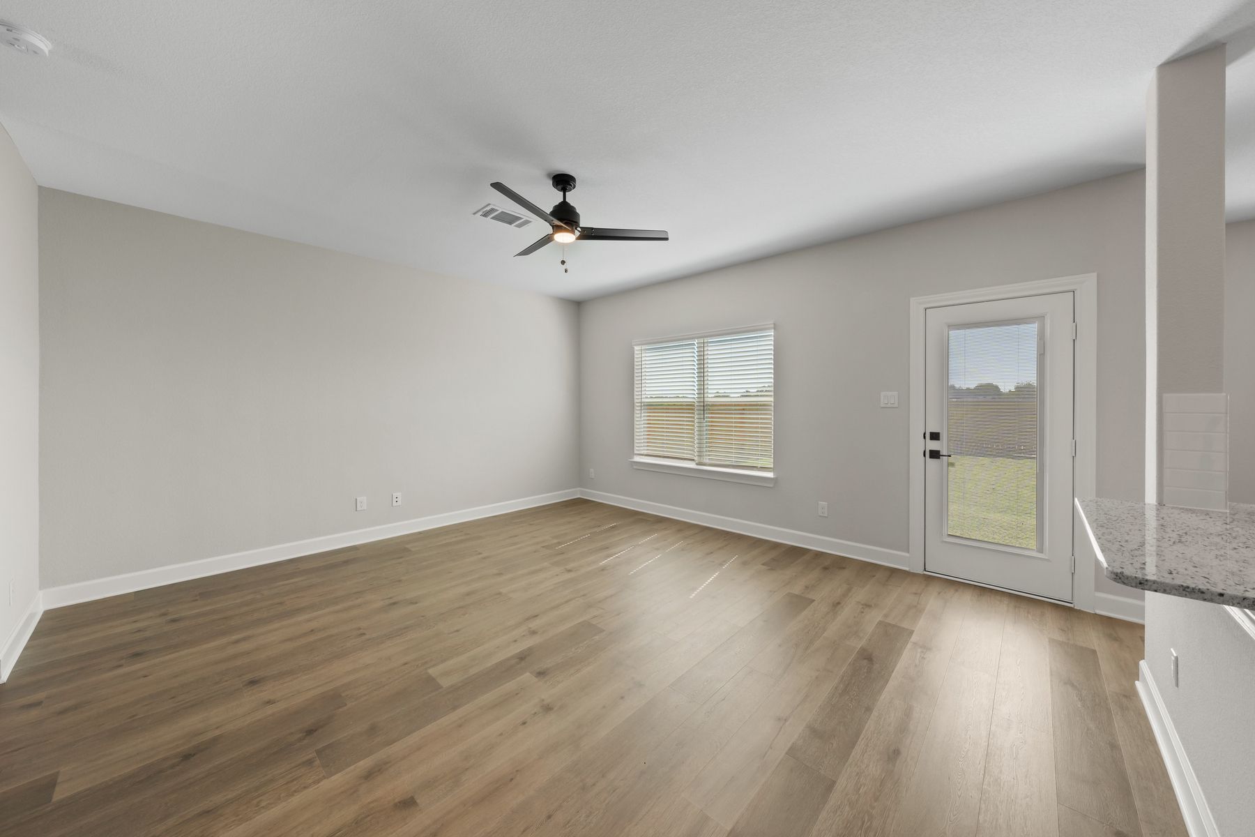 The large windows in the family room let in great, natural light.