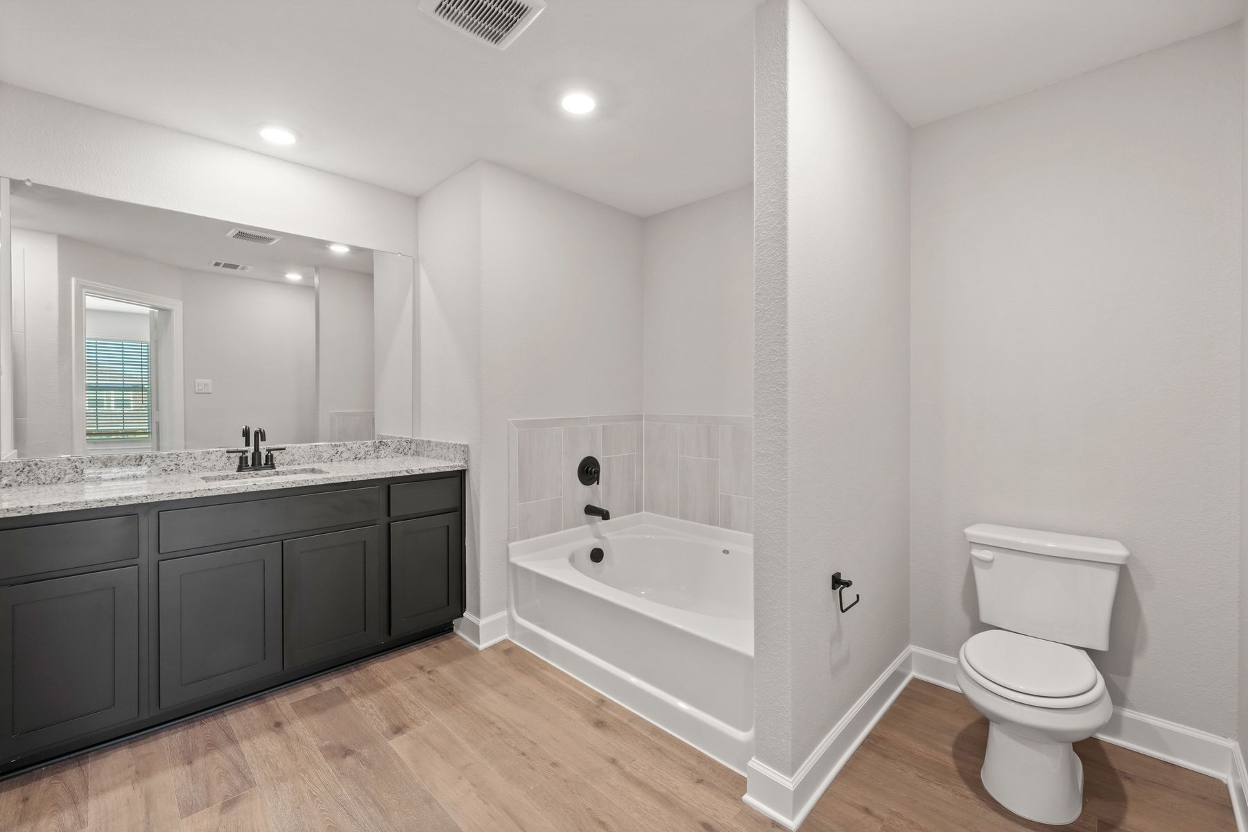 The master bathroom has a large garden tub.