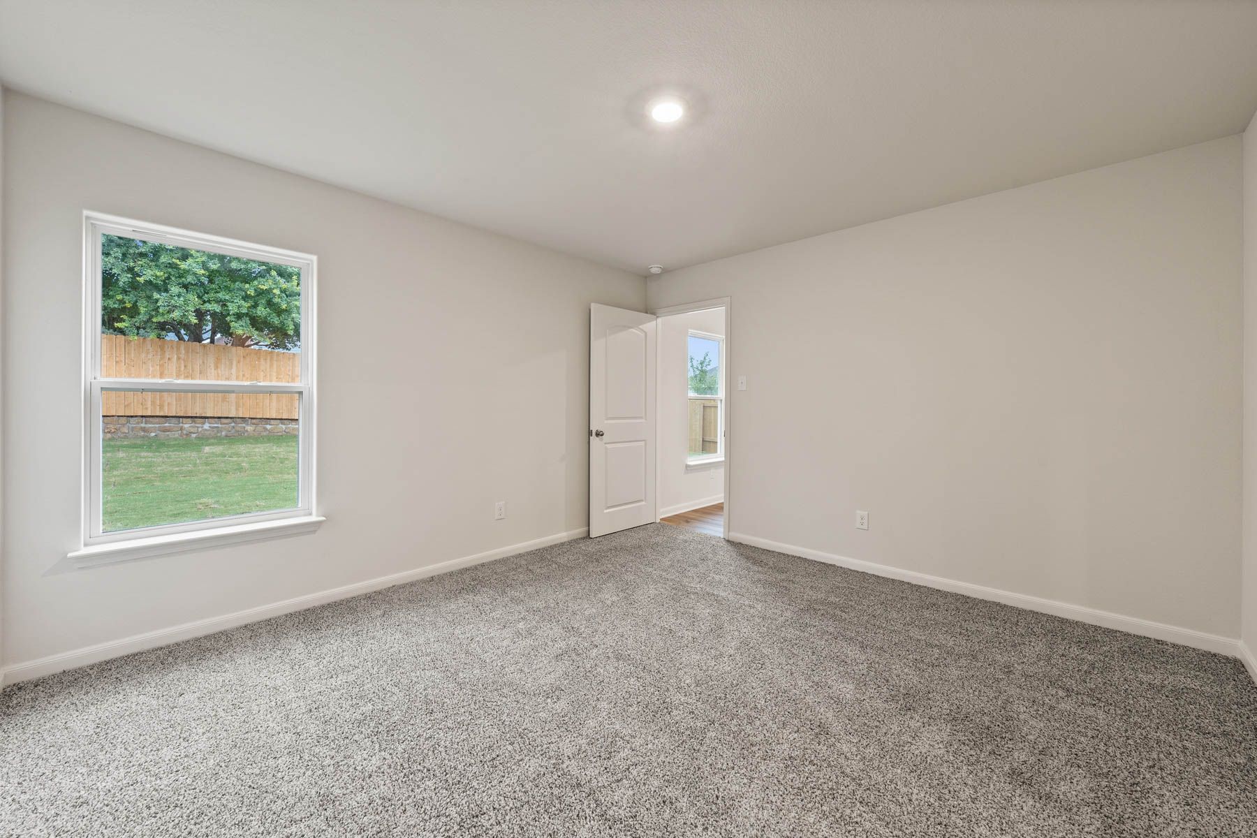 The master bedroom in the Rio Grande is large enough for your king sized furniture, and includes a large window with a great view of the back yard.