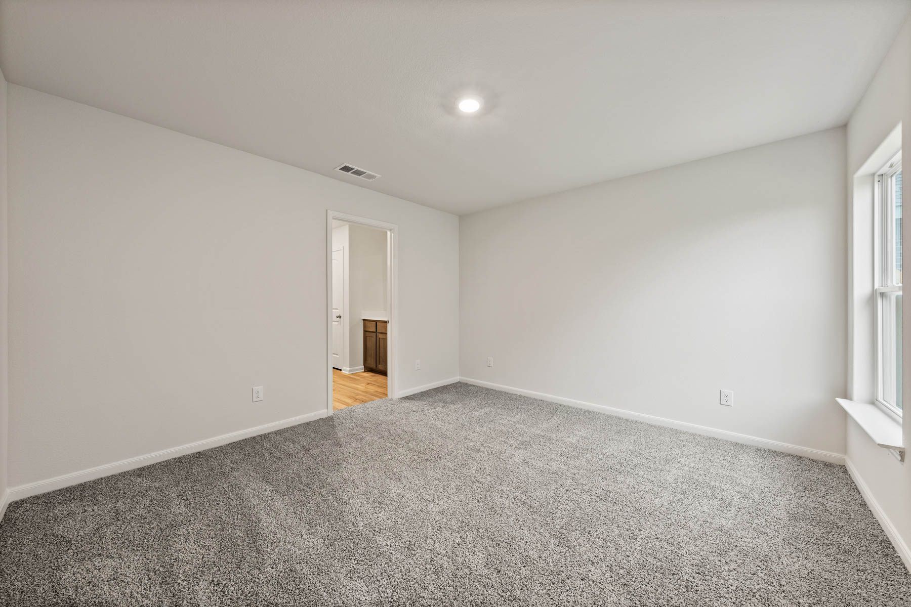 The master suite in the Rio Grande includes a large bedroom, private bathroom, and spacious walk-in closet.