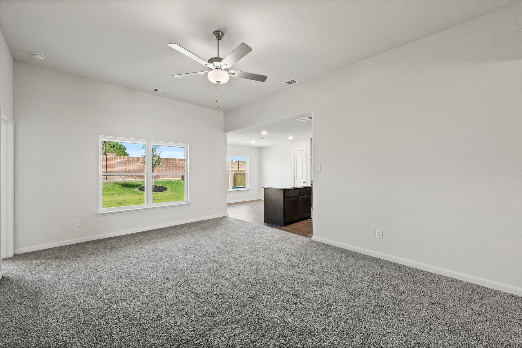The family room has large windows that let in great, natural light and backyard views.