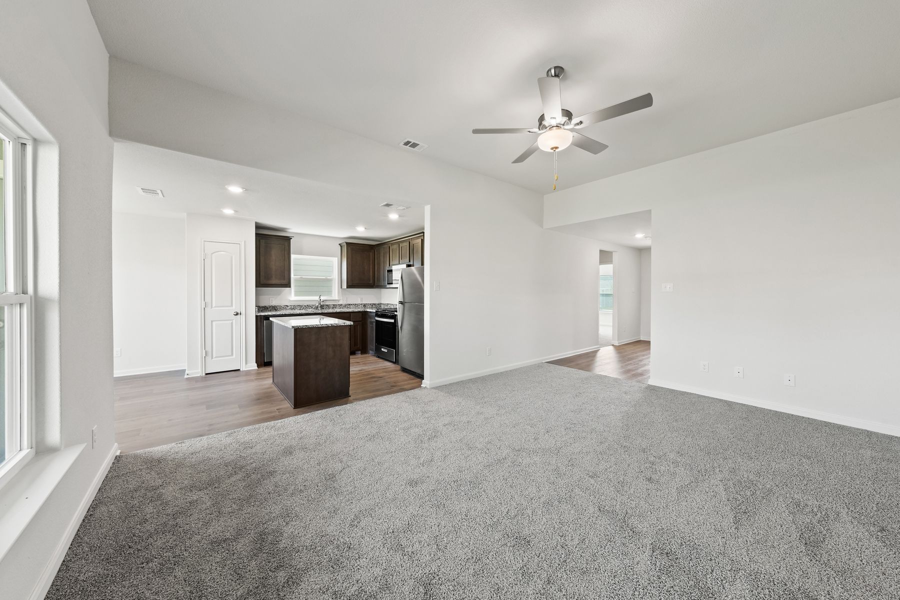The spacious family room has plenty of room for furniture.