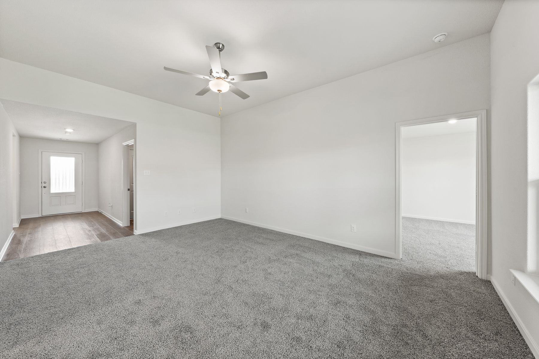 The spacious family room has plenty of room for furniture.