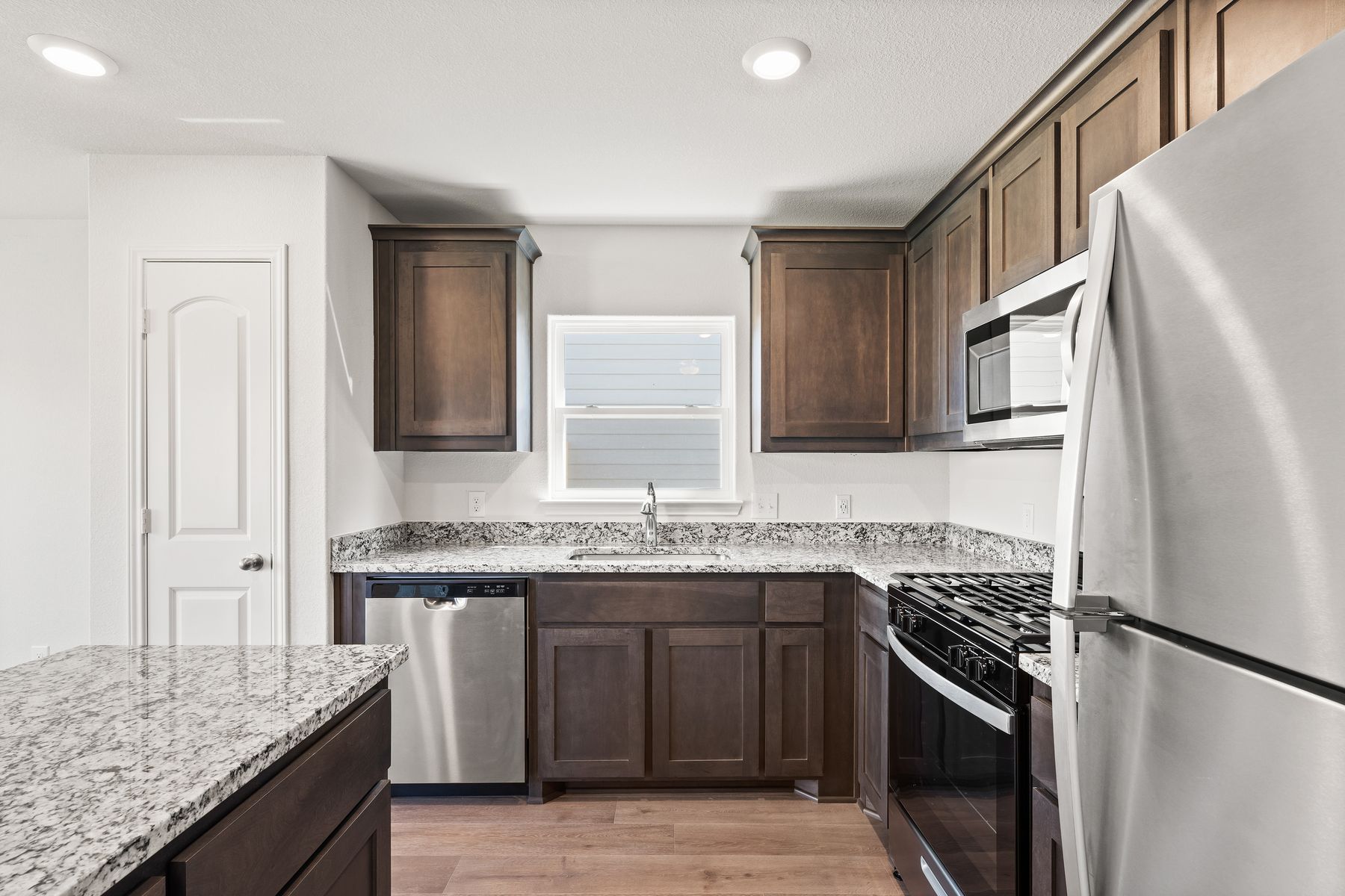 The gorgeous kitchen has energy-efficient, stainless-steel appliances.