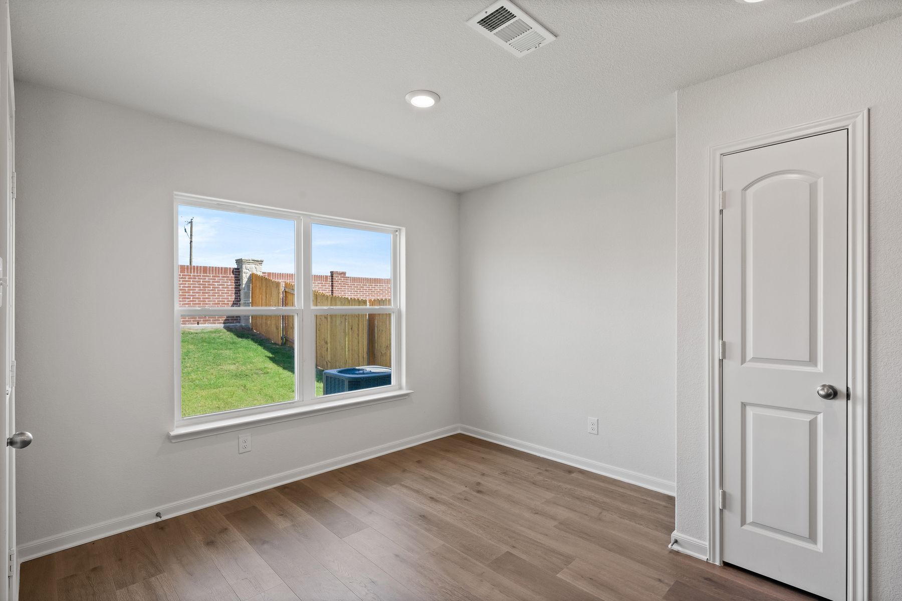 The dining room has a large window that lets in great, natural light and backyard views.