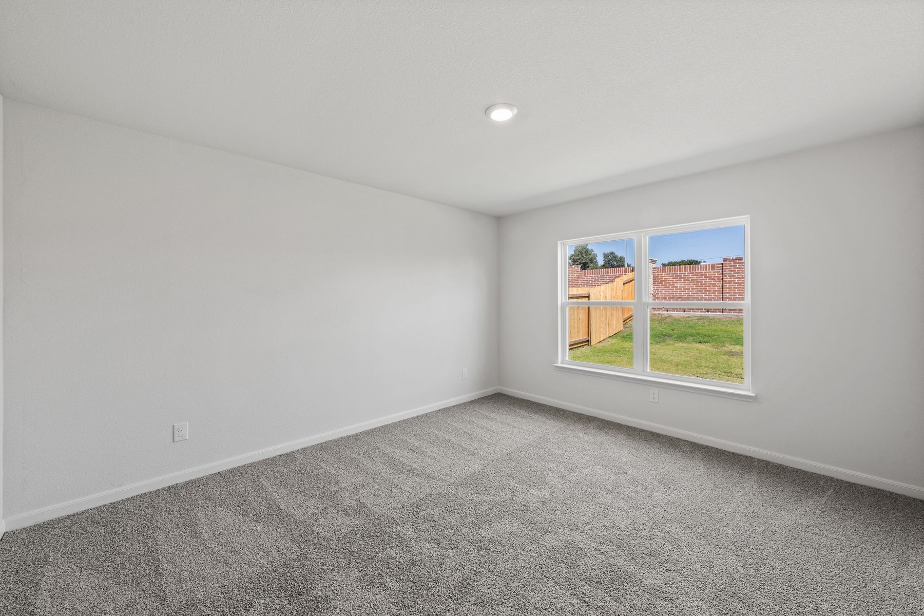 The master bedroom has a large window that lets in great, natural light.