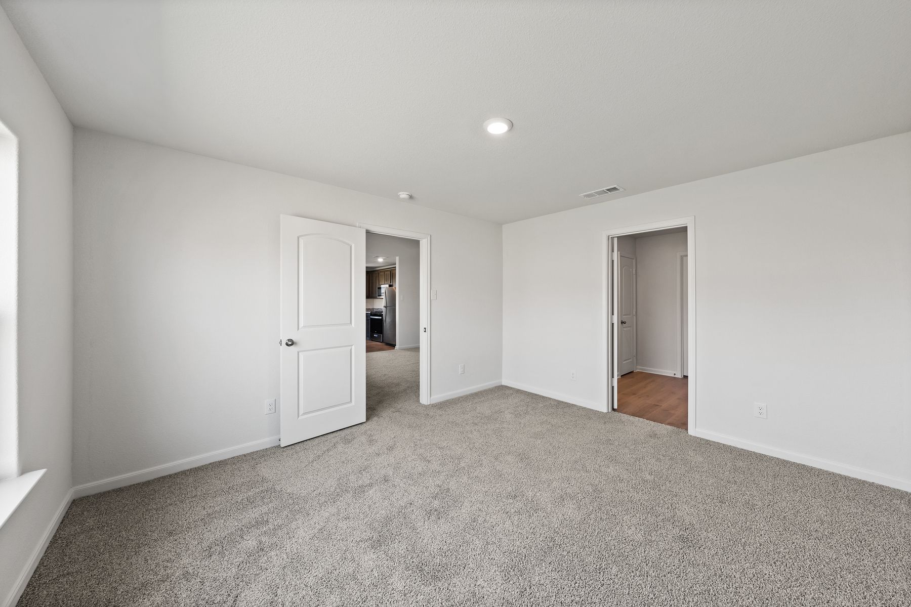 The master suite has a spacious bedroom, en-suite bathroom and walk-in closet.