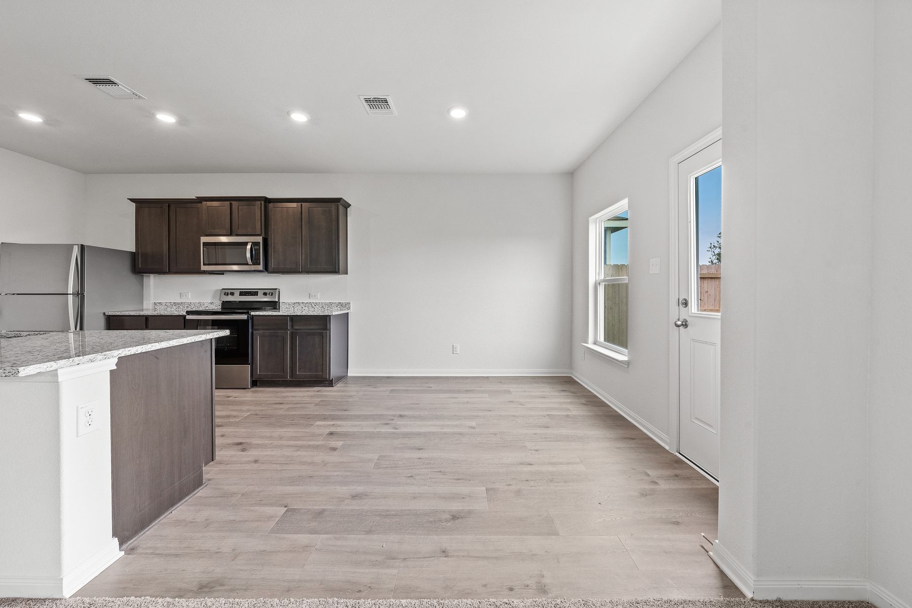 The dining room of the Cypress sits adjacent to the kitchen.