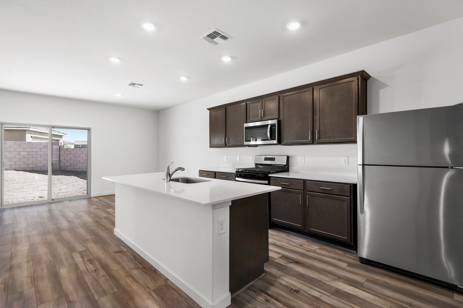 Enjoy stunning granite countertops and designer wood cabinetry in the kitchen.