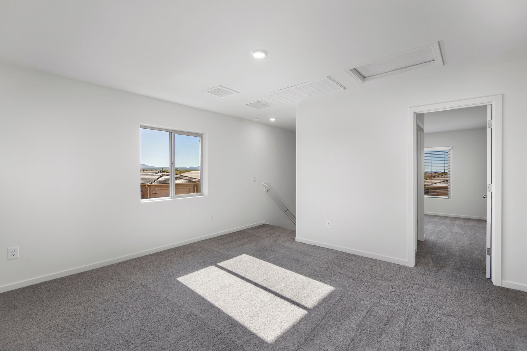 A large upstairs game room highlights this home.