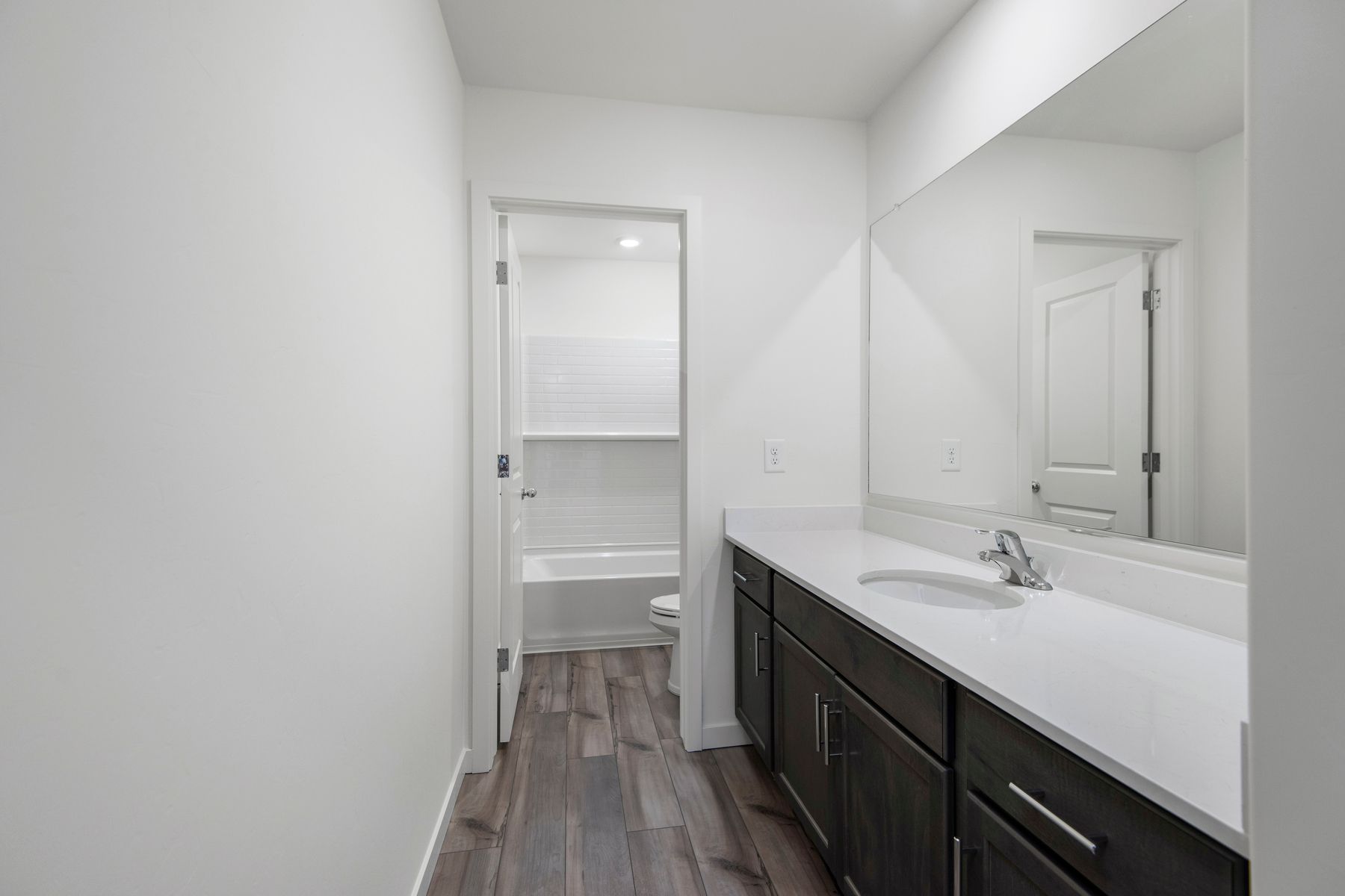 This bathroom offers a private area with a shower and tub combination.