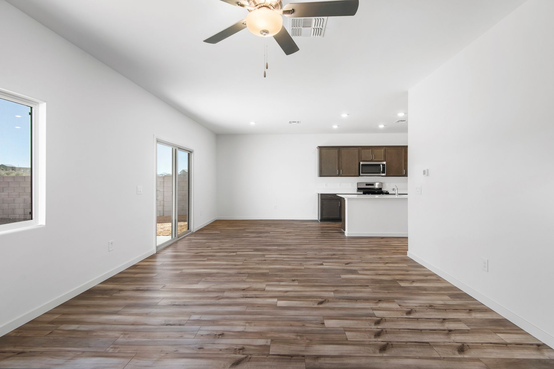 The kitchen and living room areas are a spacious open layout opening up to the back patio.