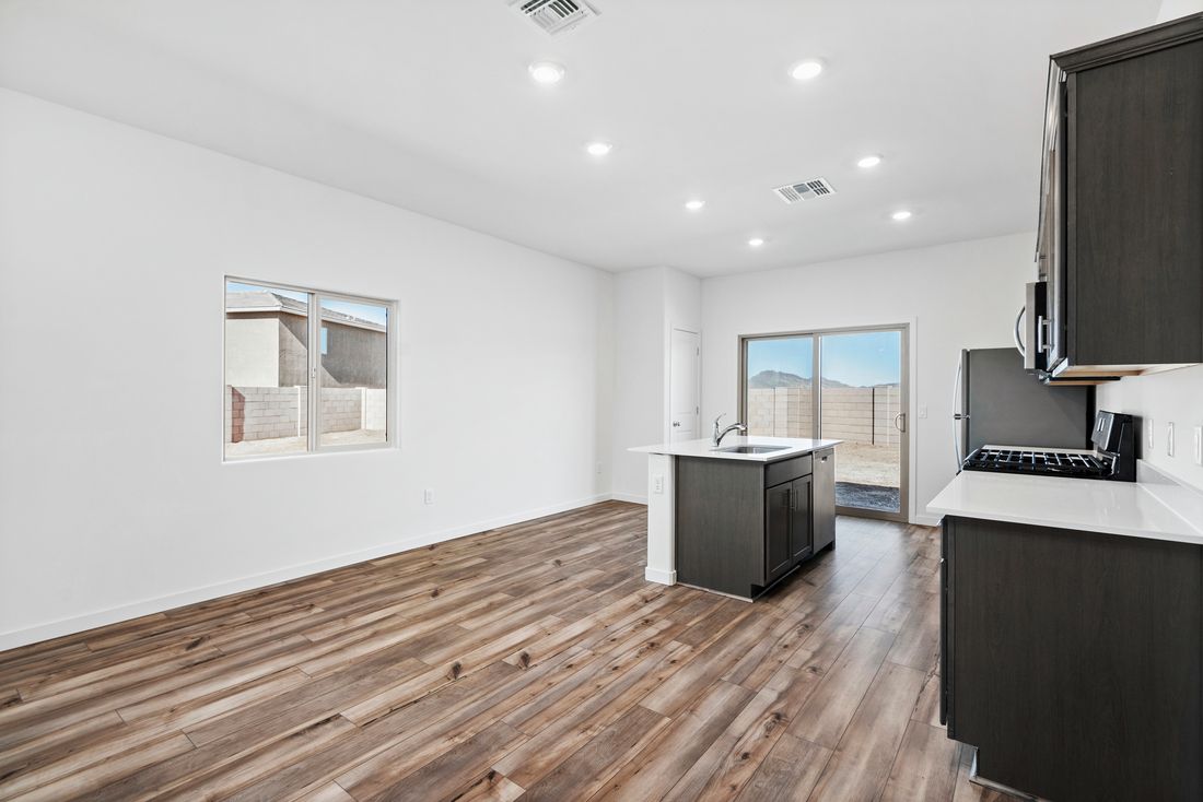 Sliding glass doors bring in natural lighting in the living area.