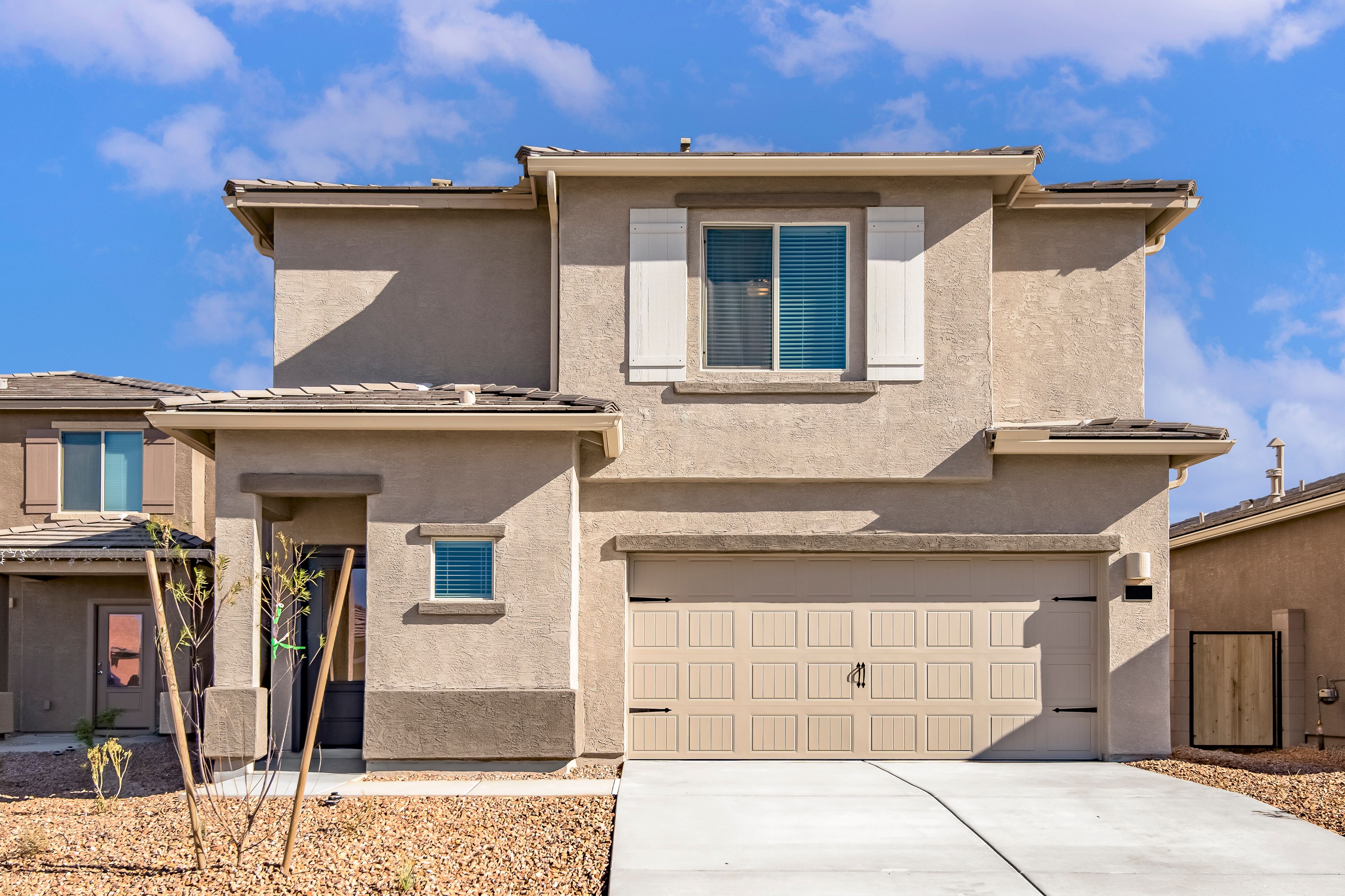 This home has a beautiful stucco exterior with a 2-car garage.