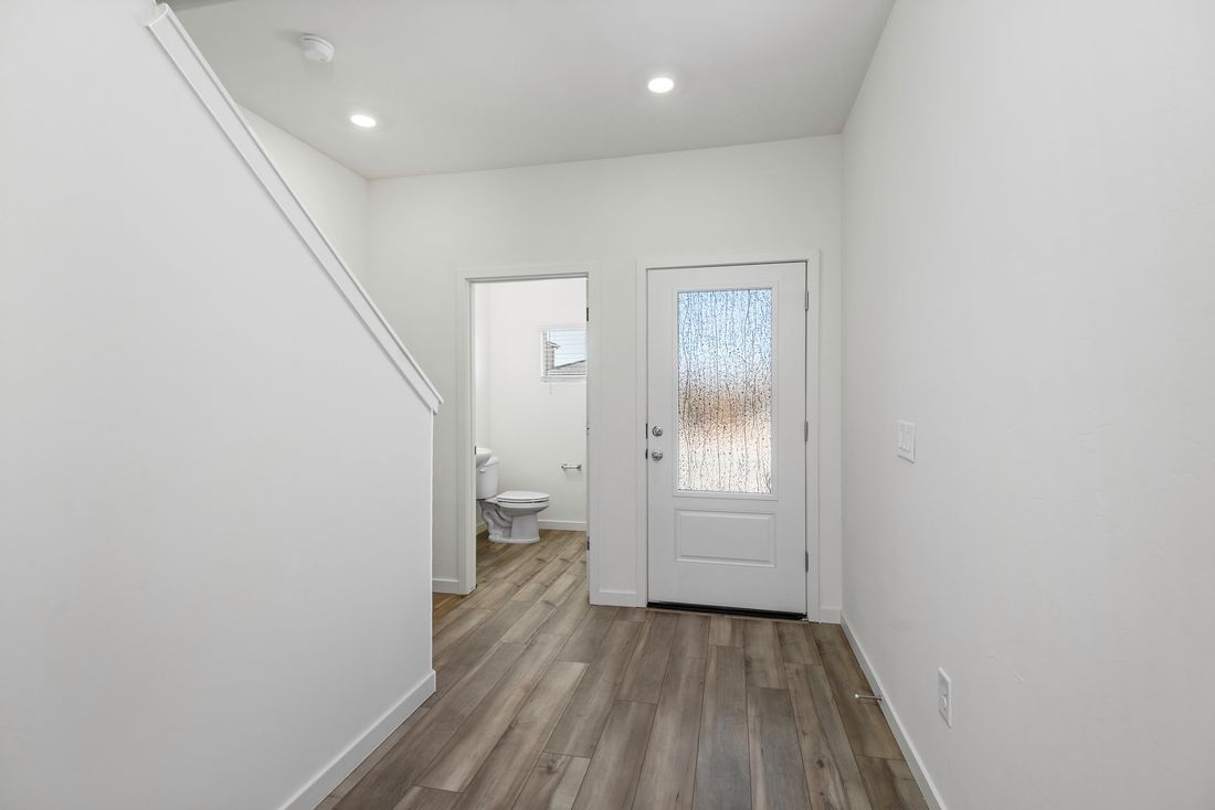 The foyer leads straight to the living room as well as the staircase.