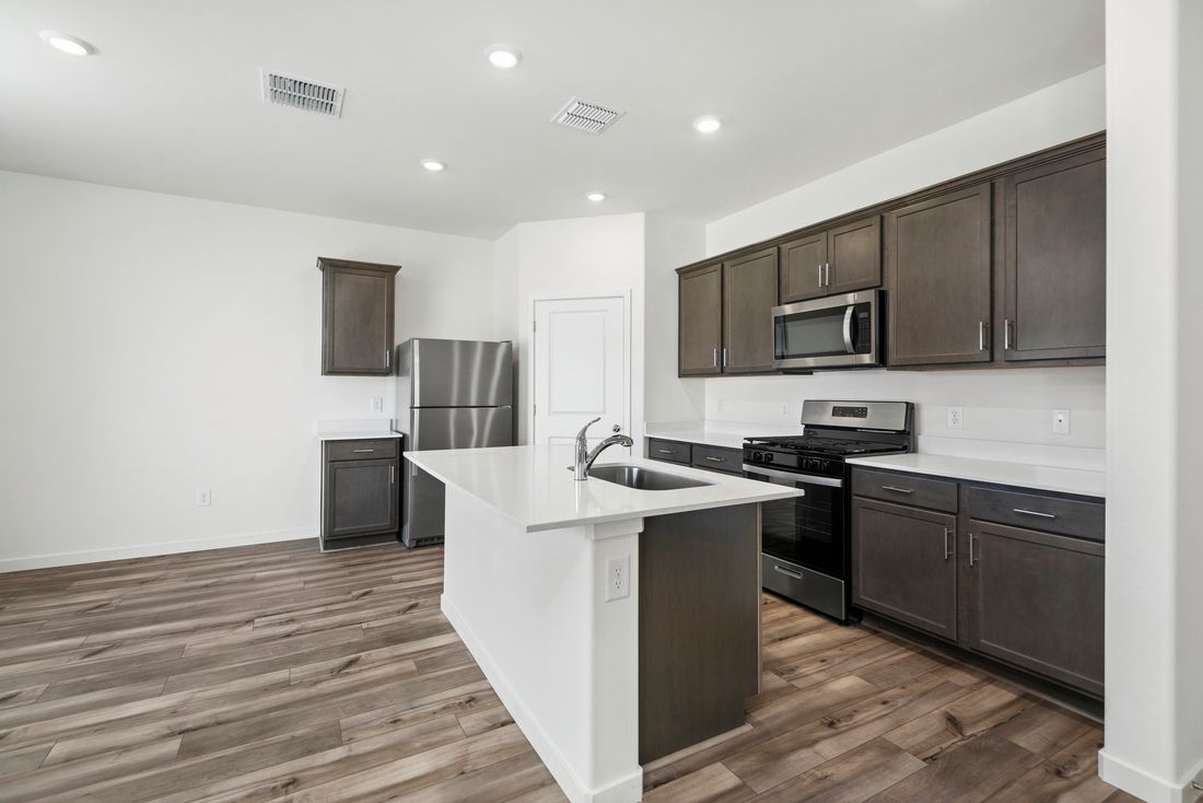 The kitchen comes with a full suite of stainless steel appliances.