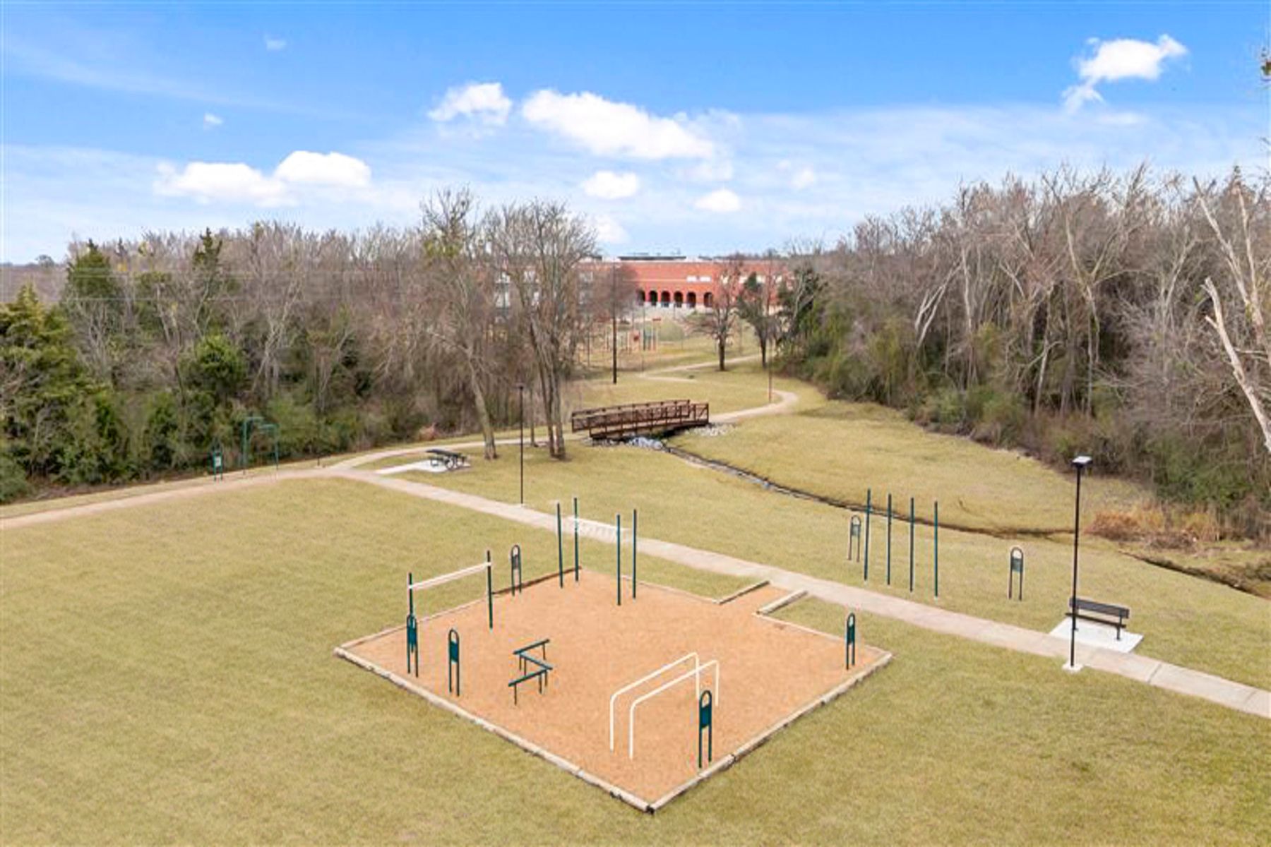 Arlie E. White Memorial Park has lots of green space for kids to play, and a bridge that leads to the elementary school.