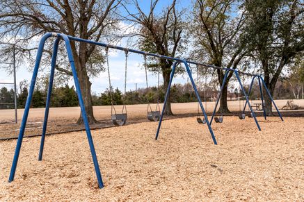 Arlie E. White Memorial Park has a swing set.