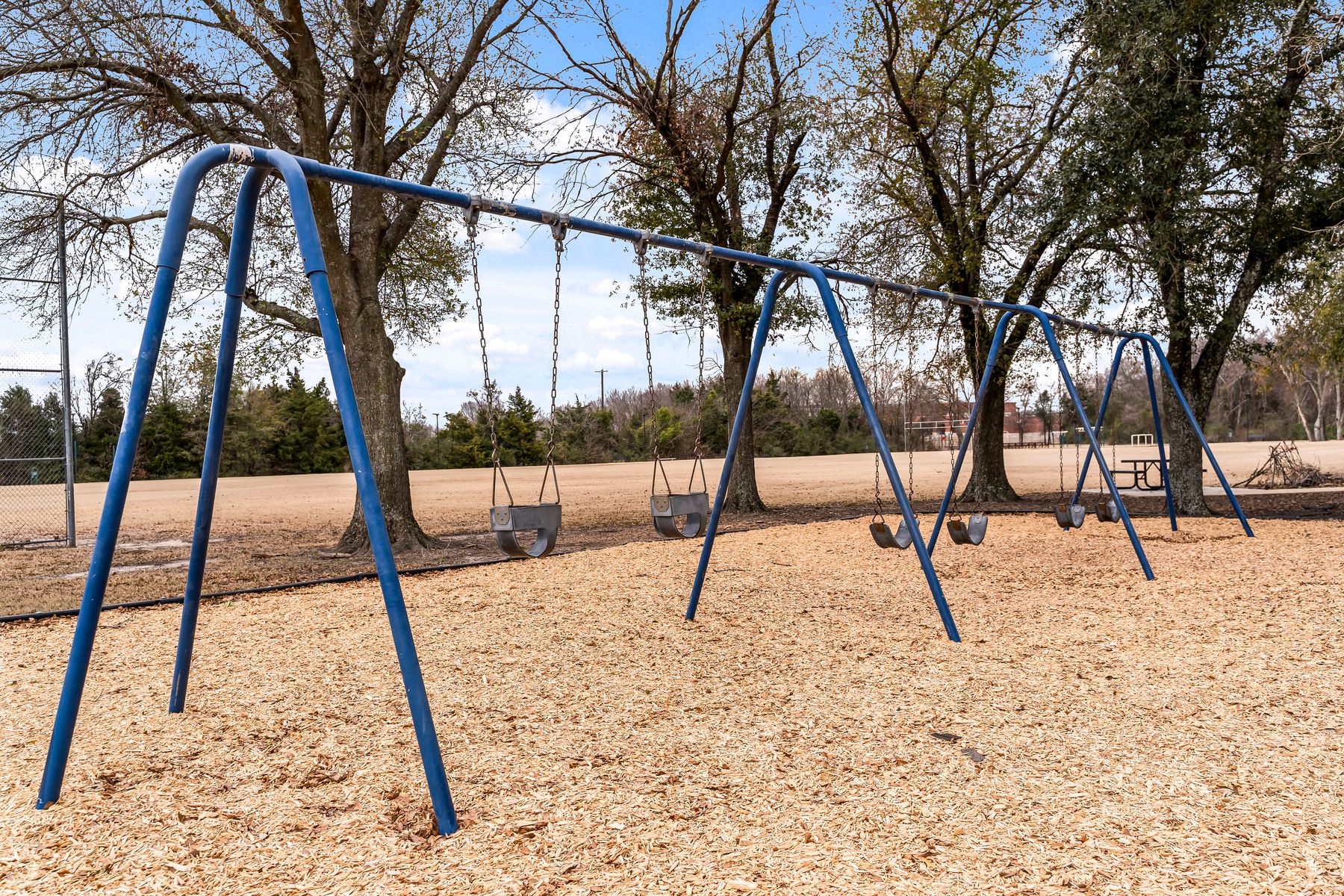 Arlie E. White Memorial Park has a swing set.