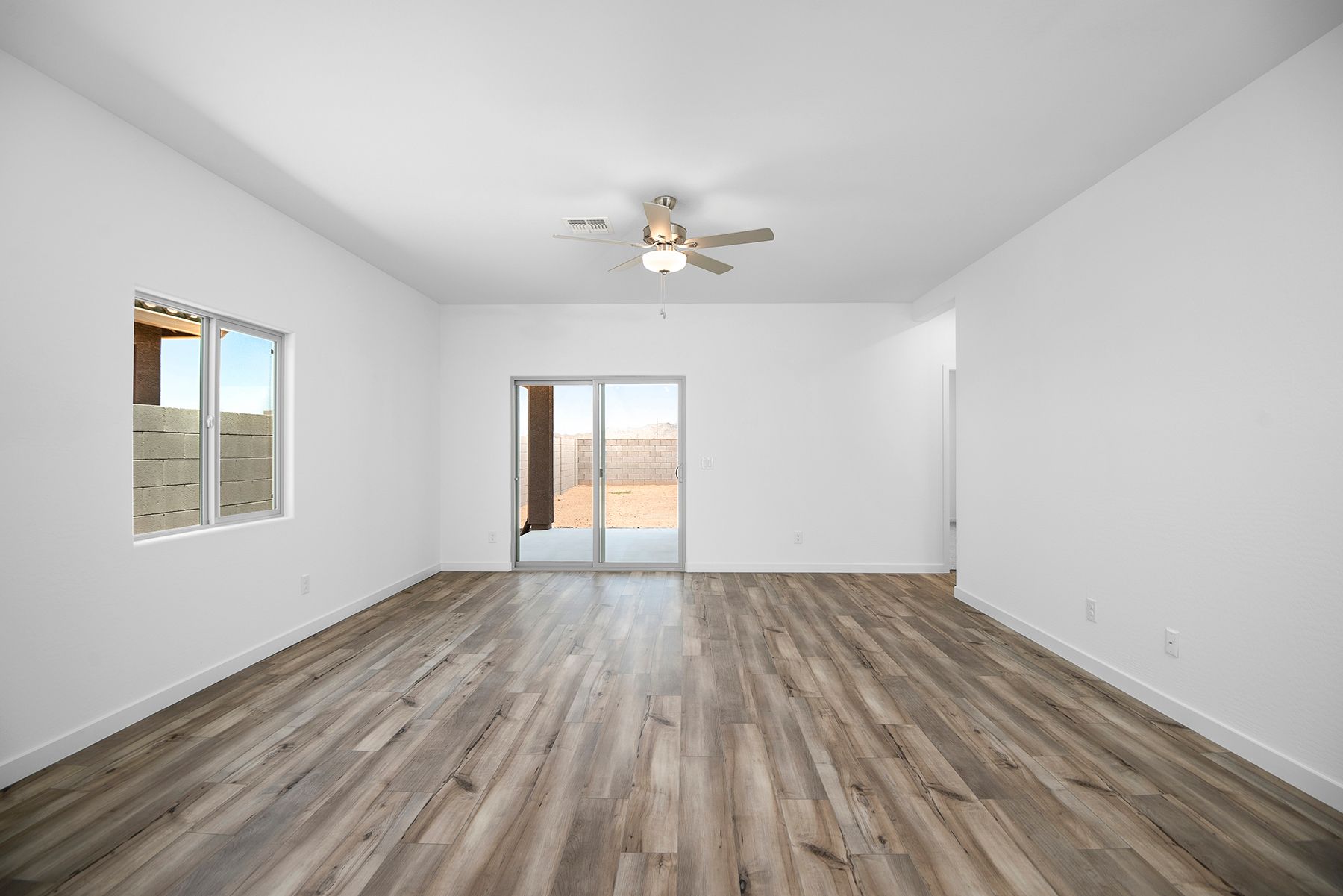 Enjoy the natural light from the beautiful sliding glass doors in the the living room.