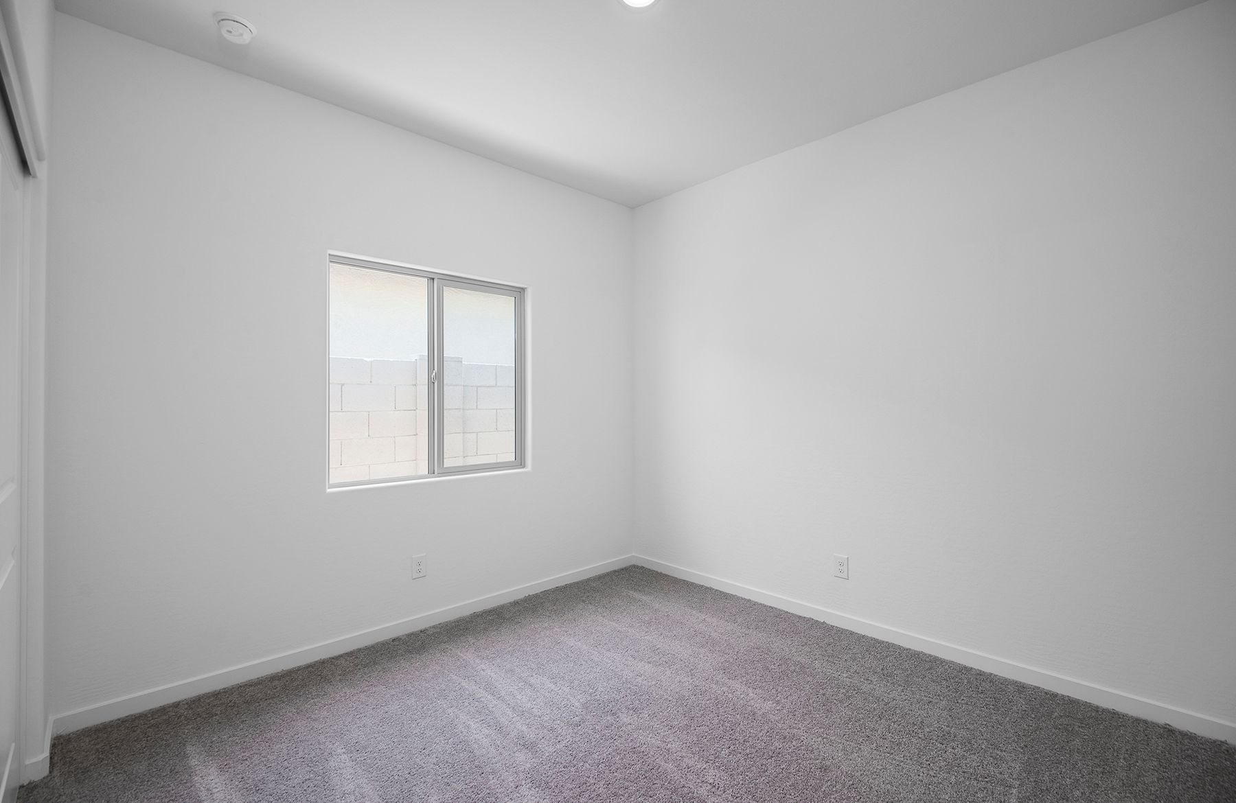 The guest bedrooms each come with natural lighting and closet space for guests to enjoy.