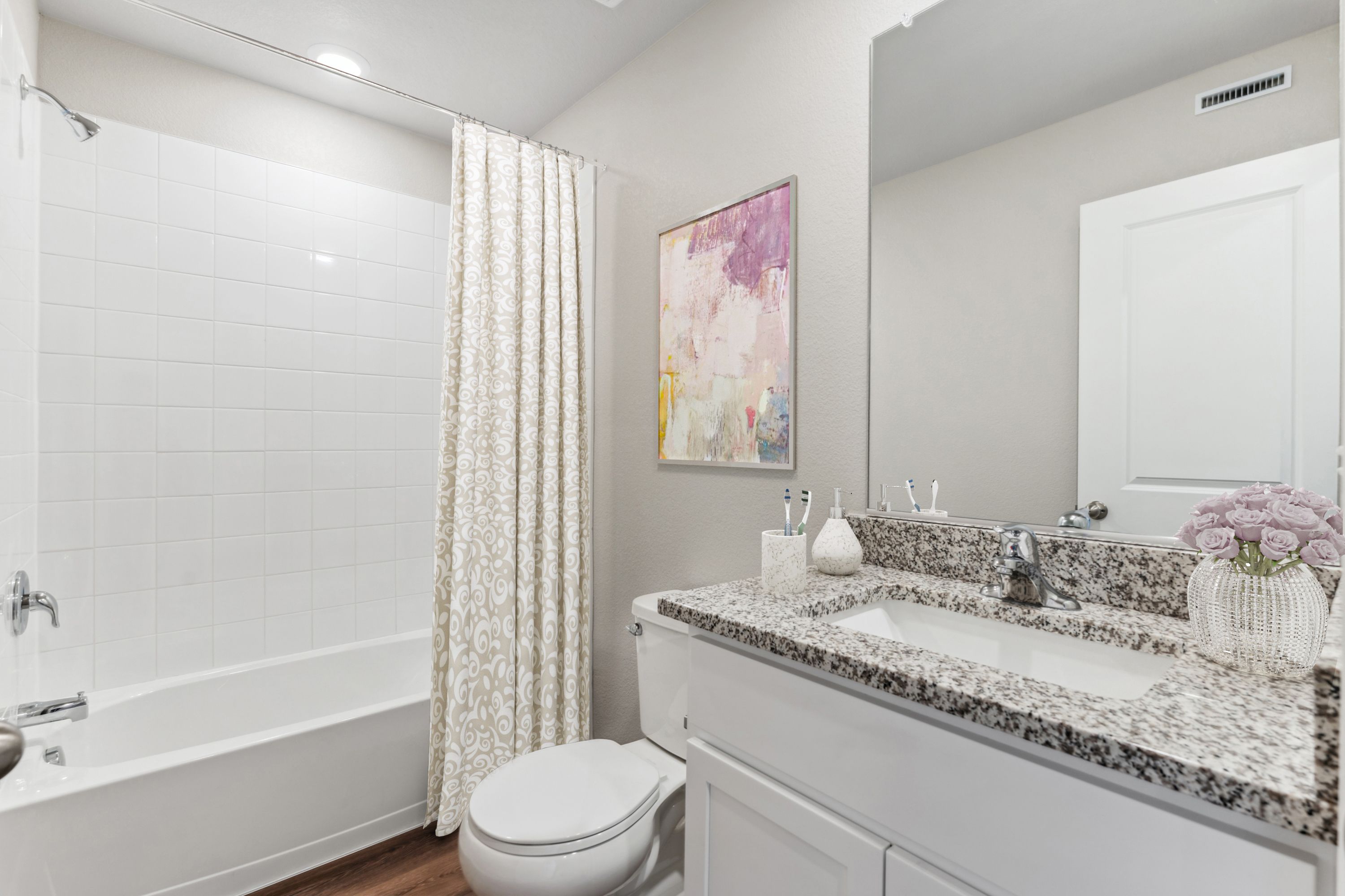 The secondary bathroom has a tub/shower combo.