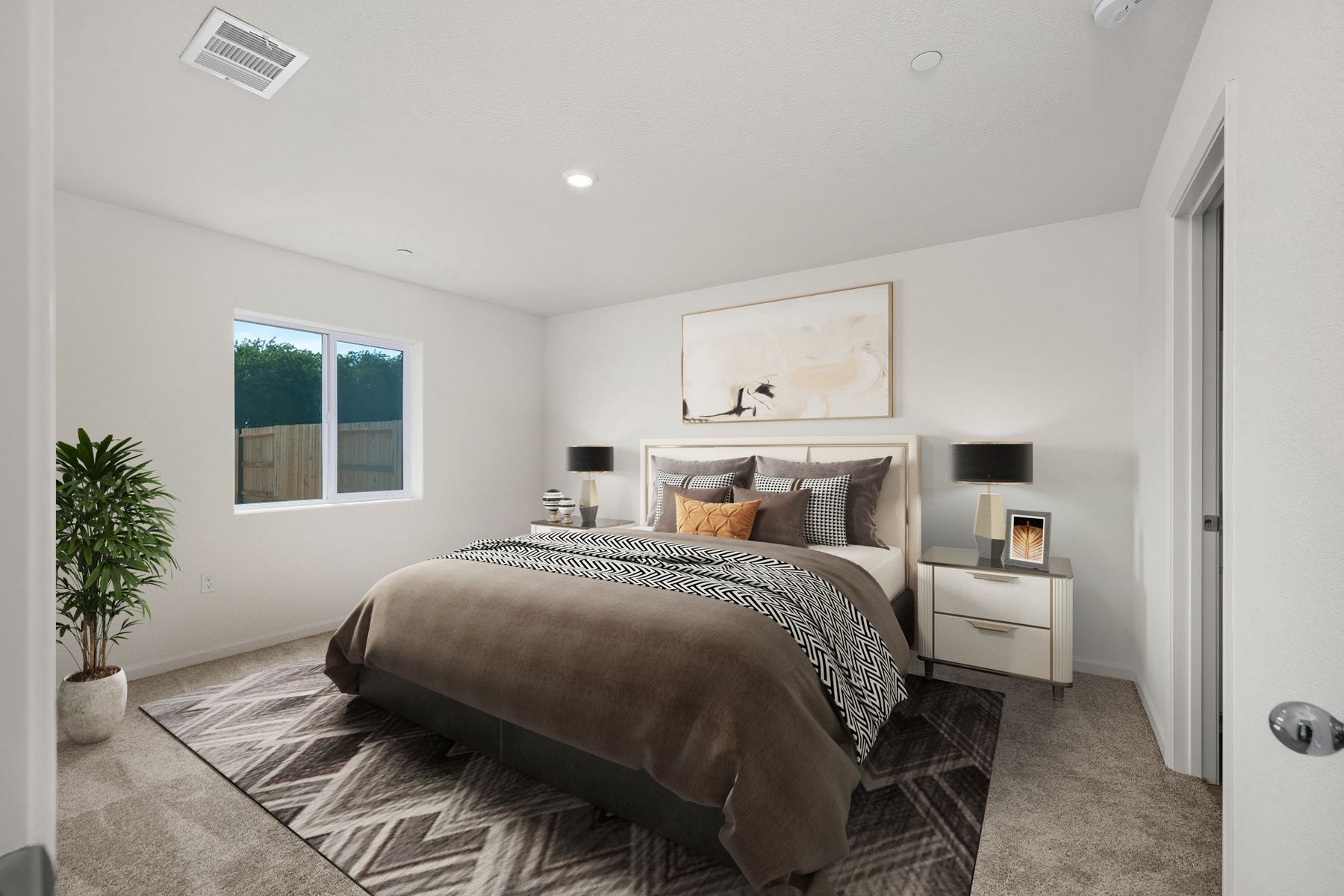 The master bedroom is spacious and has carpet.