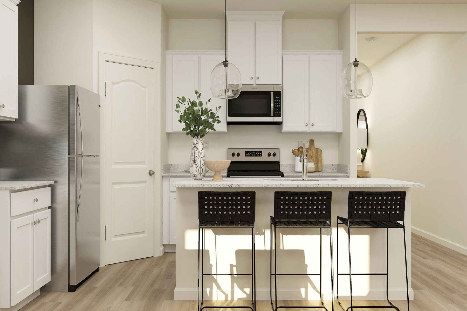 The kitchen has stainless steel appliances and plank flooring.