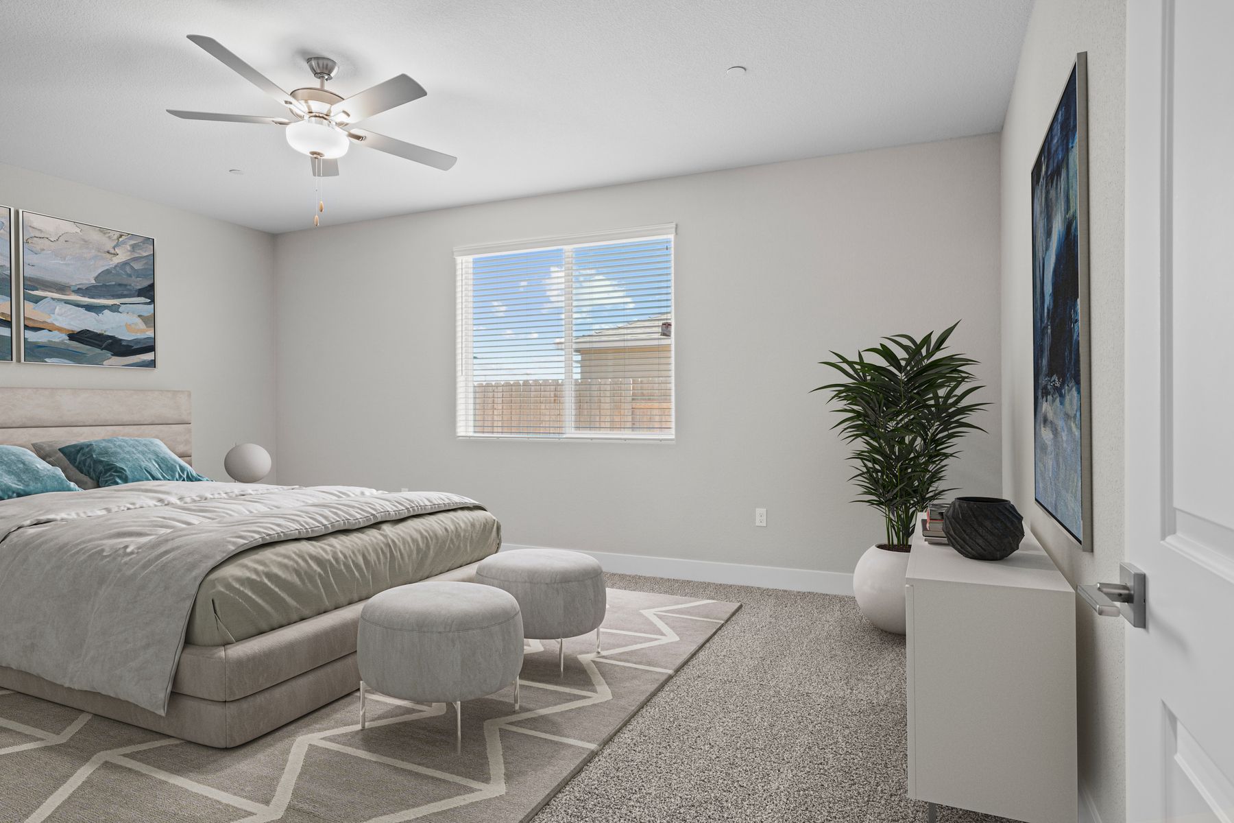 The master bedroom is spacious and has carpet.