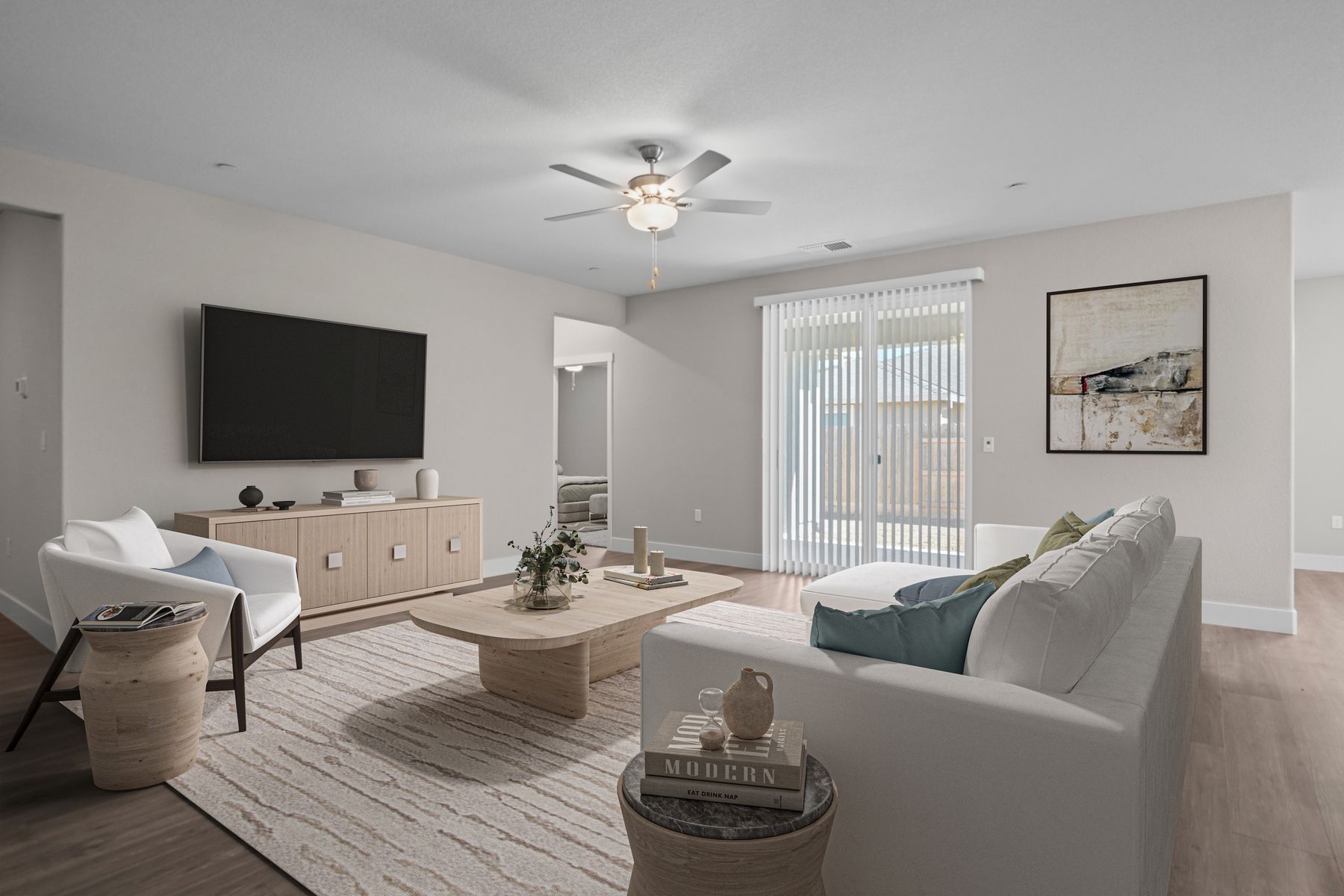 The family room is spacious with a ceiling fan.