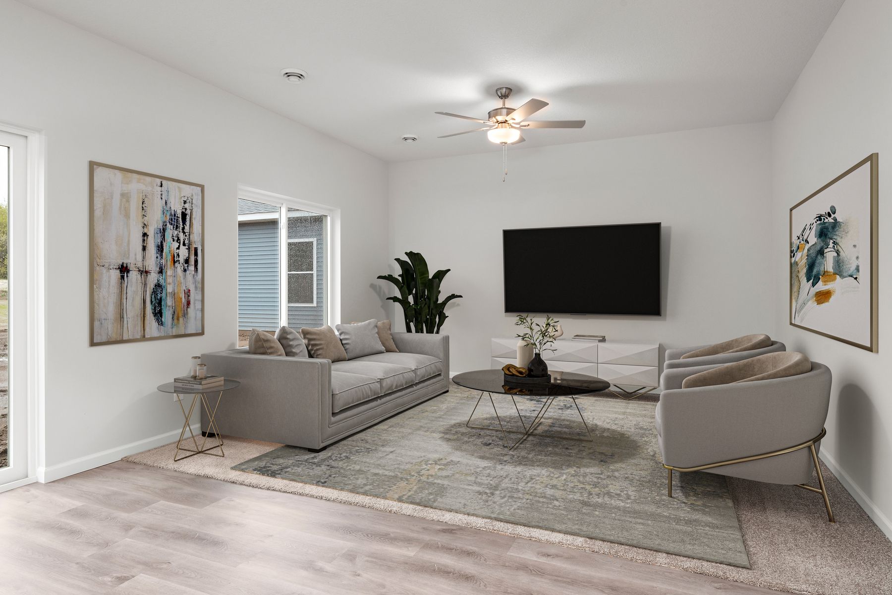 The family room is spacious with a ceiling fan.