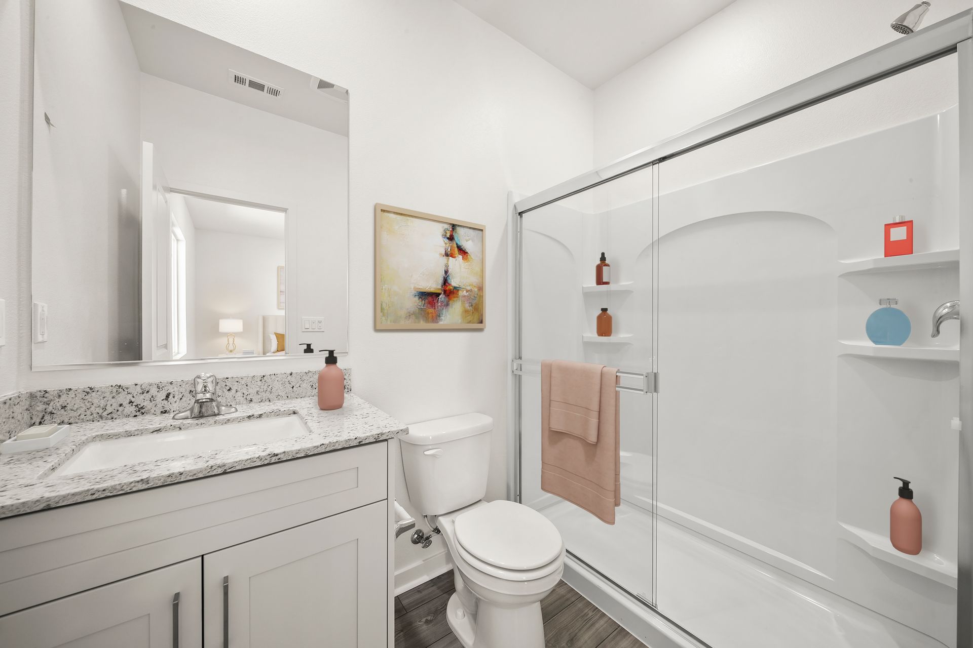 The master bathroom has a large vanity and step in shower.