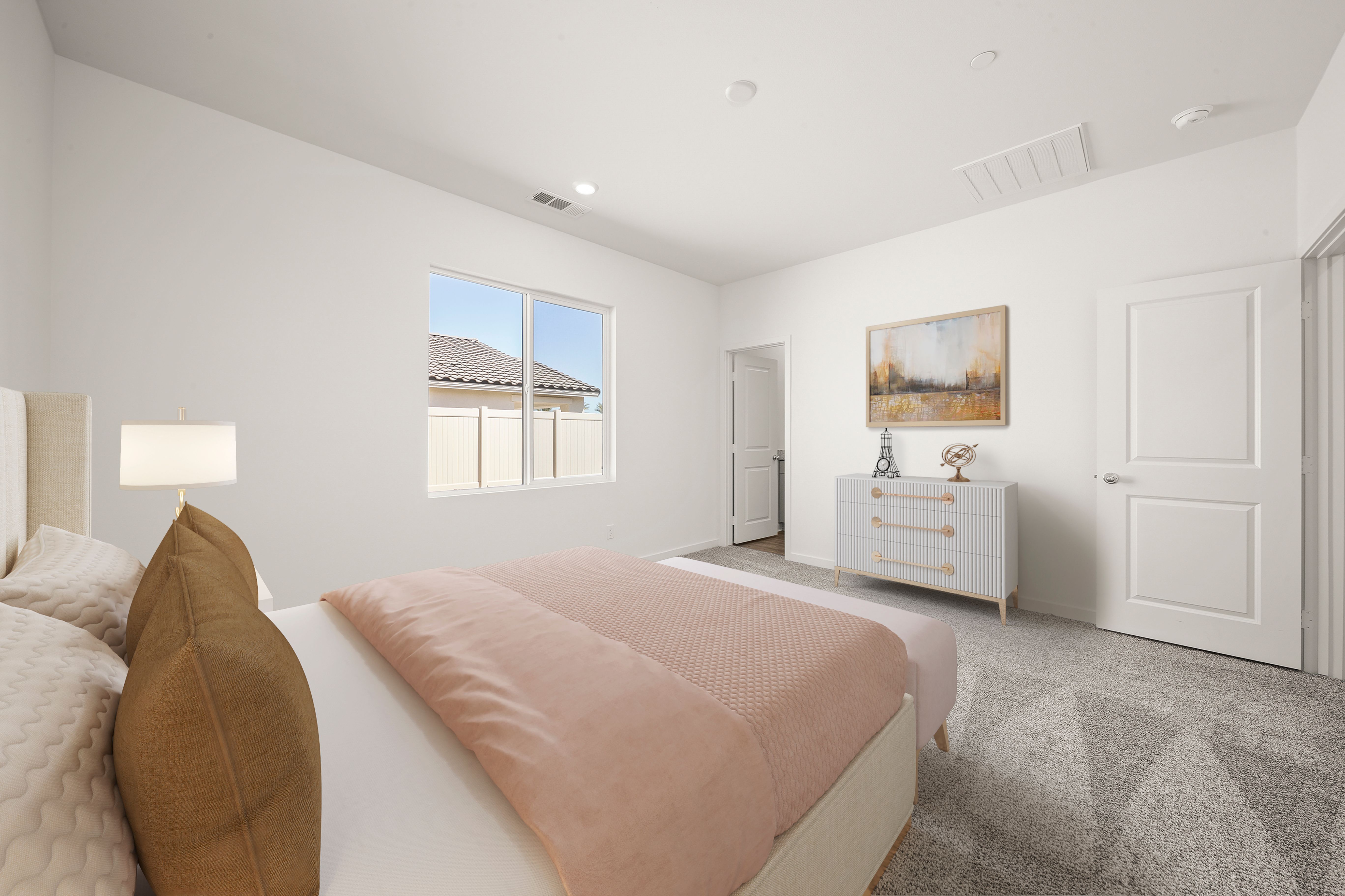 The master bedroom is spacious and has carpet.