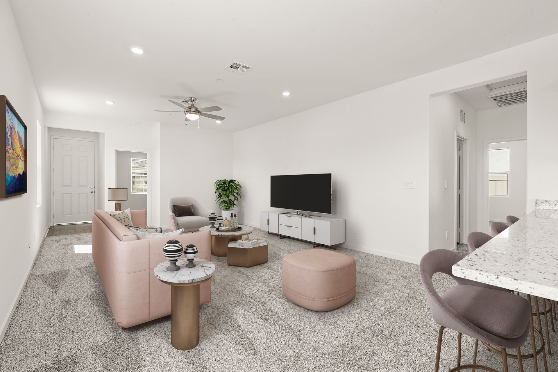 The family room is spacious with a ceiling fan.