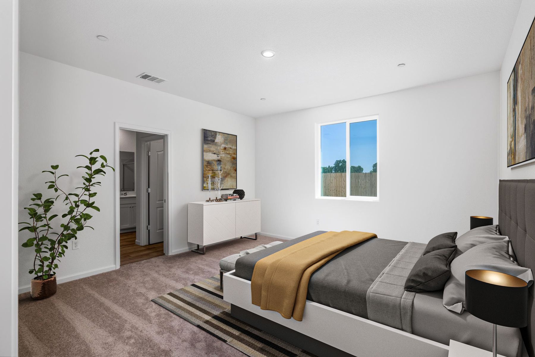 The master bedroom is spacious and has carpet.