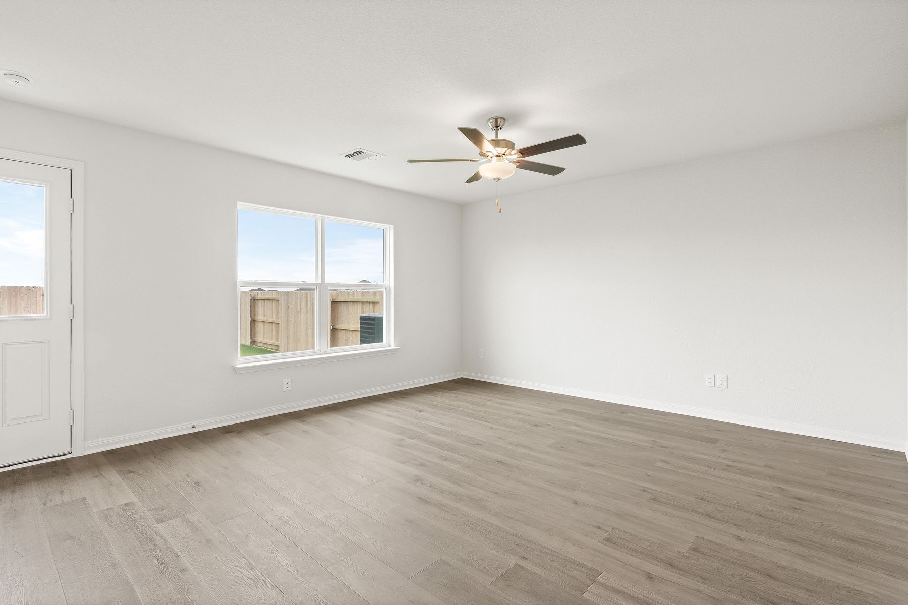 The family room is large and sits adjacent to the dining room and kitchen.