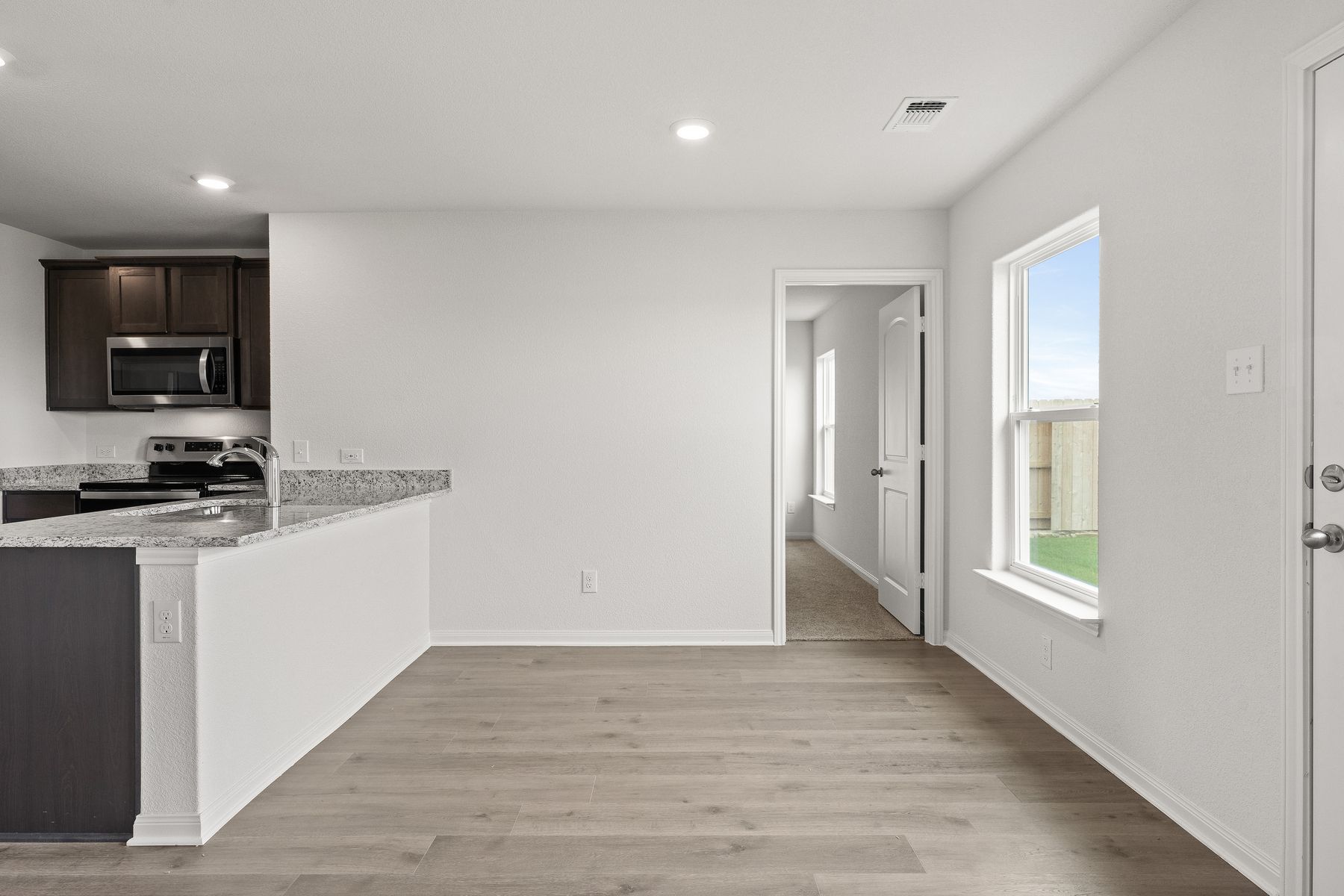 The dining room sits adjacent to the kitchen.
