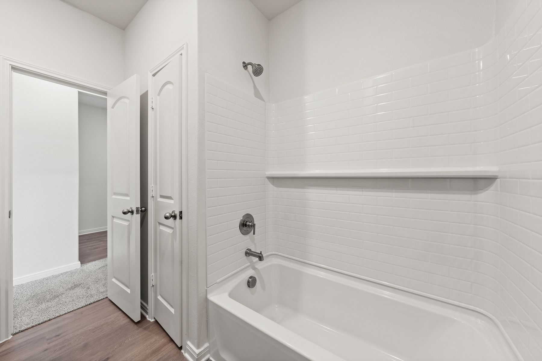 The secondary bathroom has a spacious vanity with lots of counterspace.