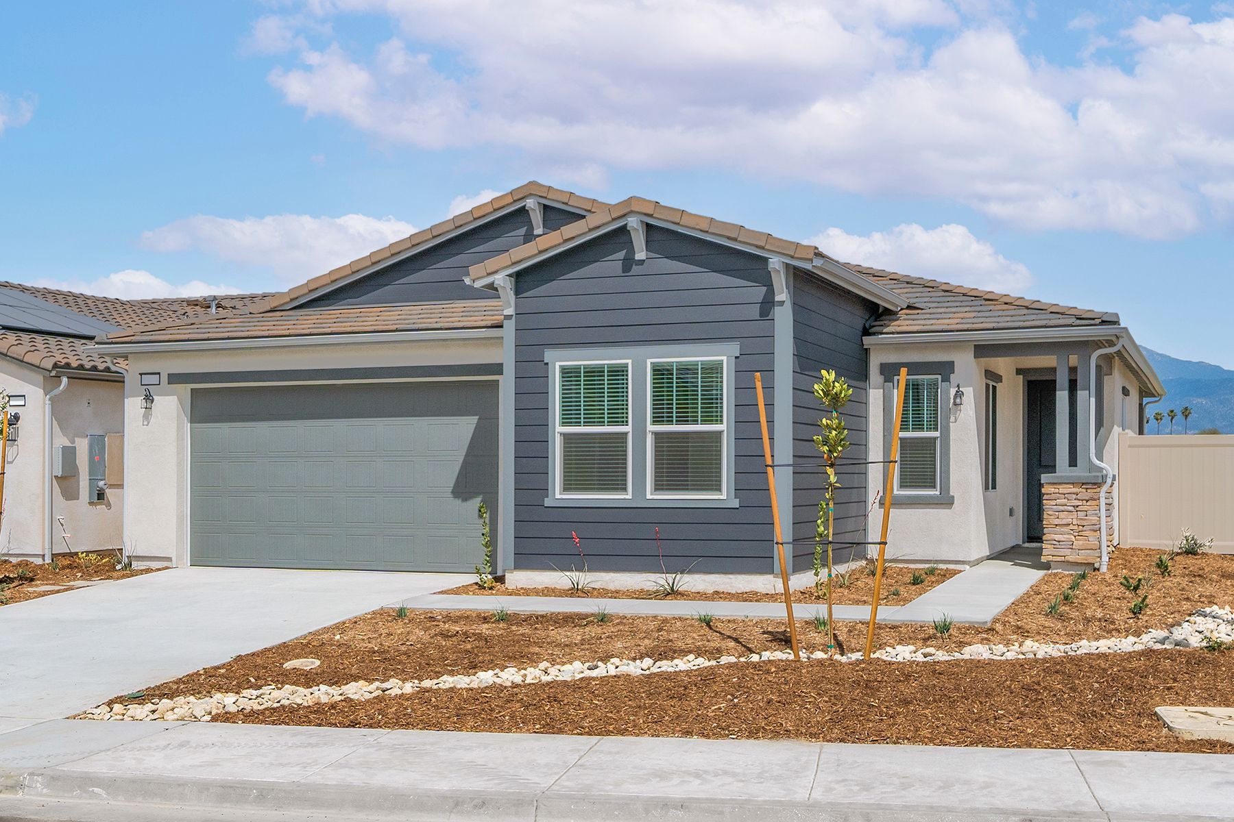 The Cottonwood is a beautiful single story home with siding.