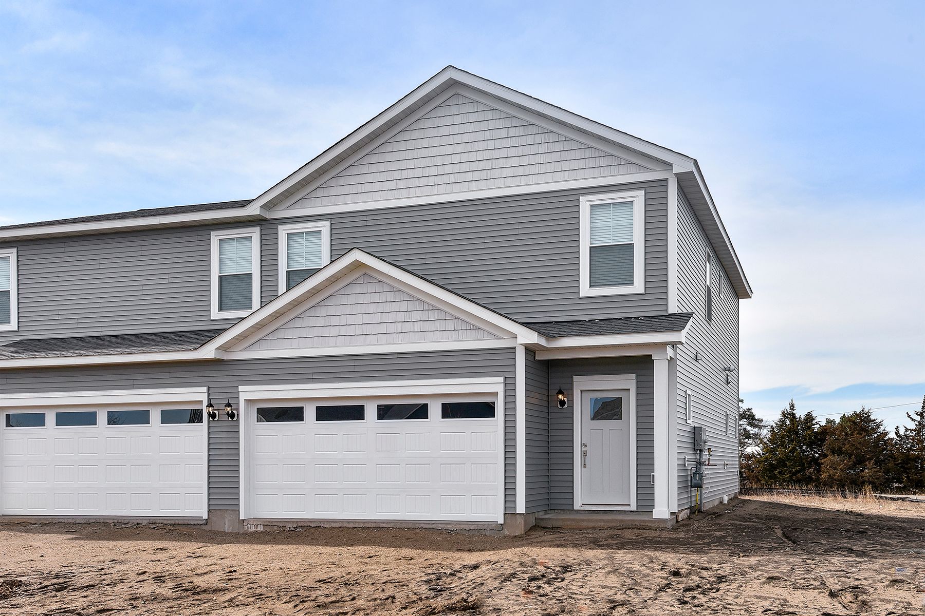 The Howard is a beautiful two story home with siding.