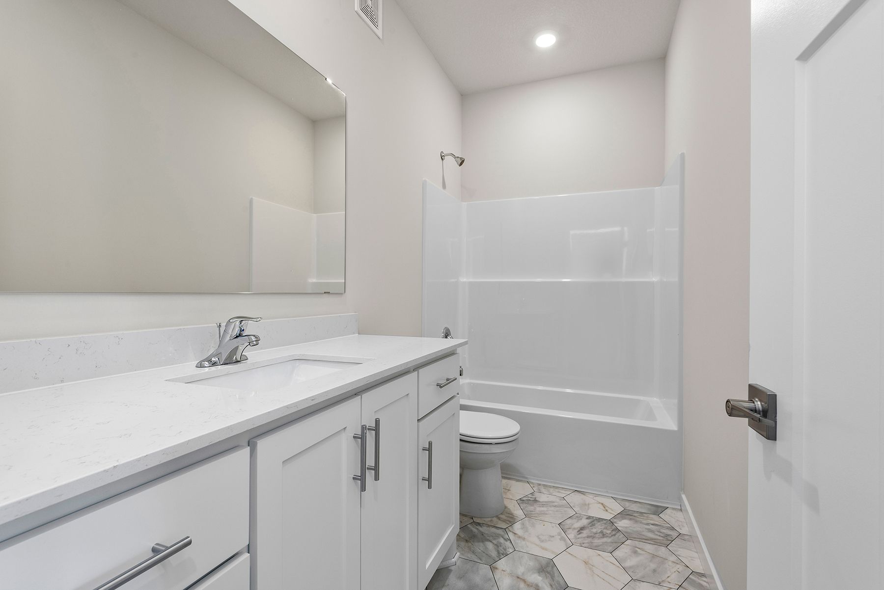 The secondary bathroom has the tub/shower combo.