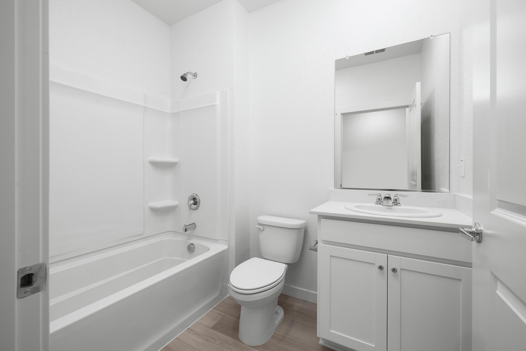 The secondary bathroom has a tub/shower combo.