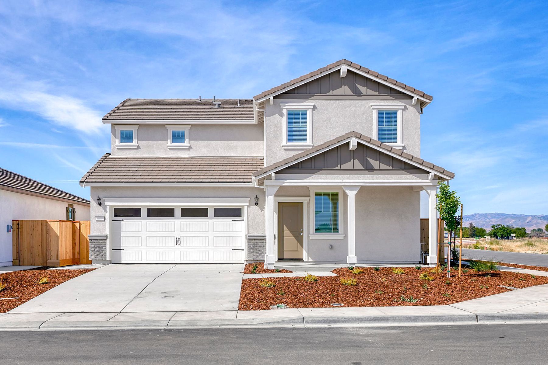 The Shelton is a beautiful two story home with stucco
